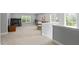Spacious carpeted loft area with ample natural light, desk, couch, and comfortable seating at 200 Woodvale Way, Fuquay Varina, NC 27526