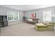 Spacious carpeted loft area with ample natural light, desk, couch, and comfortable seating at 200 Woodvale Way, Fuquay Varina, NC 27526