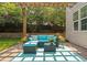 Cozy backyard patio featuring a pergola, stone wall, and comfortable outdoor seating at 200 Woodvale Way, Fuquay Varina, NC 27526