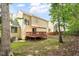 Exterior view with wooden deck surrounded by mature trees at 205 Mint Hill Dr, Cary, NC 27519