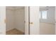 Walk-in closet with wire shelving and doorway leading into a bedroom with windows at 205 Mint Hill Dr, Cary, NC 27519