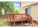 Home's wooden deck, perfect for outdoor dining, with stairs leading to the backyard at 205 Mint Hill Dr, Cary, NC 27519