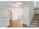 Open floor plan with staircase to second floor and chandelier in dining room at 205 Mint Hill Dr, Cary, NC 27519