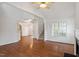 Open living room with hardwood floors and access to stairs, dining room and fireplace at 205 Mint Hill Dr, Cary, NC 27519