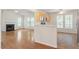 View of the living room and kitchen with hardwood and tile flooring at 205 Mint Hill Dr, Cary, NC 27519