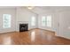 Spacious living room with hardwood floors, fireplace, and ample natural light at 205 Mint Hill Dr, Cary, NC 27519