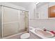 A full bathroom with a shower-tub combination and peach-colored sink and tile at 2081 Stone Street Ext, Mebane, NC 27302
