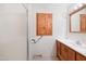 Bathroom features a stand up shower, wooden cabinets, and mirror at 2081 Stone Street Ext, Mebane, NC 27302