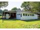 Exterior shot of an old outbuilding with various shelters and storage at 2081 Stone Street Ext, Mebane, NC 27302