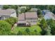 Aerial view of a private backyard, wooden fence, screened in porch and spacious green lawn at 2104 Brockfield Ct, Raleigh, NC 27614