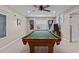 Spacious game room with a pool table, banners, and neutral carpet providing entertainment at 2104 Brockfield Ct, Raleigh, NC 27614