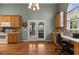 Bright kitchen features a built-in desk, backyard views, and access to an outdoor patio at 2104 Brockfield Ct, Raleigh, NC 27614