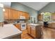 Bright kitchen boasts light wood cabinets, modern appliances, and hardwood floors at 2104 Brockfield Ct, Raleigh, NC 27614