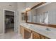 Main bathroom featuring a dual vanity and a large mirror at 2104 Brockfield Ct, Raleigh, NC 27614
