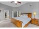 Main bedroom with a ceiling fan, vaulted ceiling, and ensuite bathroom at 2104 Brockfield Ct, Raleigh, NC 27614