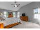 Spacious main bedroom featuring a vaulted ceiling, ceiling fan, and two dressers at 2104 Brockfield Ct, Raleigh, NC 27614