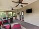 Relaxing screened porch with ceiling fans and ample seating, for outdoor living at 2104 Brockfield Ct, Raleigh, NC 27614