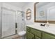 Bright bathroom featuring a glass shower, modern vanity, and stylish decor at 220 Oxfordshire Dr, Fuquay Varina, NC 27526