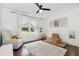 Inviting bedroom with a large window, neutral tones, and cozy accents at 220 Oxfordshire Dr, Fuquay Varina, NC 27526