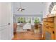 Open-concept living area with vaulted ceilings, hardwood floors, and lots of natural light at 220 Oxfordshire Dr, Fuquay Varina, NC 27526