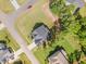Overhead view of home with large lot, long driveway, and mature trees on a cul-de-sac at 220 W Amber Oak Dr, Selma, NC 27576