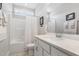 Clean bathroom featuring white cabinets, a tub with shower, and bright lighting at 220 W Amber Oak Dr, Selma, NC 27576
