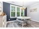 Charming dining area with a round table, bench seating, and a stylish chandelier, perfect for Gathering meals at 220 W Amber Oak Dr, Selma, NC 27576