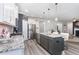 Modern kitchen with granite countertops, a large island, stainless steel appliances, and stylish pendant lighting at 220 W Amber Oak Dr, Selma, NC 27576