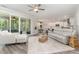 Bright and airy living room featuring a comfortable seating arrangement and sliding doors to the screened porch at 220 W Amber Oak Dr, Selma, NC 27576