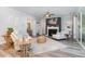 Cozy living room with a fireplace, comfortable furniture, and ample natural light, ideal for relaxation at 220 W Amber Oak Dr, Selma, NC 27576