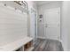 Organized mudroom with a built-in bench, hooks, and storage baskets, providing a practical and stylish entryway at 220 W Amber Oak Dr, Selma, NC 27576