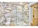Modern bathroom features a luxurious walk-in shower with marble-style tile and sleek fixtures at 2203 University Dr, Durham, NC 27707