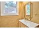 Elegant bathroom featuring a modern mirror, stylish vanity, and contemporary fixtures at 2203 University Dr, Durham, NC 27707