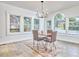 Bright dining room with lots of light from the multiple windows at 2203 University Dr, Durham, NC 27707