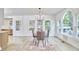 Bright dining room featuring a modern chandelier, large windows, and an open concept design at 2203 University Dr, Durham, NC 27707