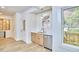A stylish kitchenette featuring stainless steel appliances, quartz countertops, and modern finishes at 2203 University Dr, Durham, NC 27707