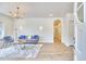 Bright living room showcasing modern decor, recessed lighting, and lovely hardwood floors at 2203 University Dr, Durham, NC 27707