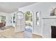 Bright living room showcasing arched entry, with open door to the home's exterior at 2203 University Dr, Durham, NC 27707