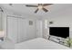 Bedroom with a ceiling fan, closet, and a TV on a glass stand at the foot of the bed at 3007 Shopton Dr, Apex, NC 27502