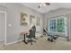 Spacious bedroom features a ceiling fan, neutral walls, and a window with a view at 3007 Shopton Dr, Apex, NC 27502