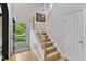 Bright foyer with hardwood floors, staircase, and ample natural light at 3007 Shopton Dr, Apex, NC 27502