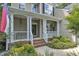 Inviting front porch with brick steps, columns, and a charming entrance at 3007 Shopton Dr, Apex, NC 27502