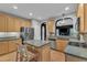 Bright kitchen featuring stainless appliances, granite counters, and a center island with seating at 3007 Shopton Dr, Apex, NC 27502