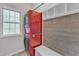 Laundry room featuring a stacked washer/dryer unit and mudroom-style storage bench at 3007 Shopton Dr, Apex, NC 27502