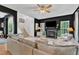 Cozy living room with fireplace, hardwood floors, and lots of natural light at 3007 Shopton Dr, Apex, NC 27502