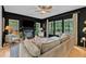 Elegant living room with a fireplace, large windows, and hardwood floors at 3007 Shopton Dr, Apex, NC 27502