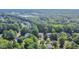 An aerial view showcasing the neighborhood's lush green landscape and well-spaced homes at 302 Caraway Ln, Cary, NC 27519