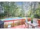 Spacious back deck adjacent to pool, great for outdoor living and enjoying serene backyard views at 302 Caraway Ln, Cary, NC 27519