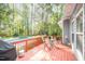 Relaxing back deck area with a view of the pool and backyard, perfect for outdoor gatherings at 302 Caraway Ln, Cary, NC 27519