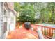 Inviting back deck area, perfect for entertaining with backyard pool access and lush green scenery at 302 Caraway Ln, Cary, NC 27519